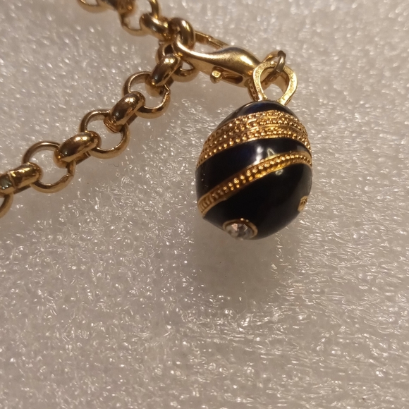 Faberge egg charm bracelet on a gold tone rolo chain. - Picture 14 of 16